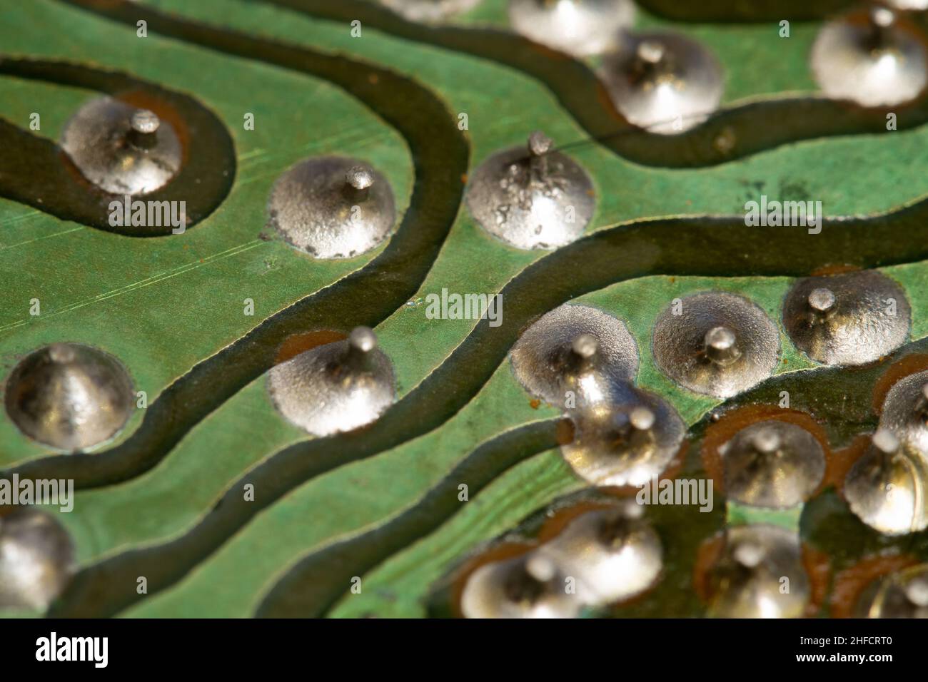 Green old printed circuit board (PCB). Stock Photo