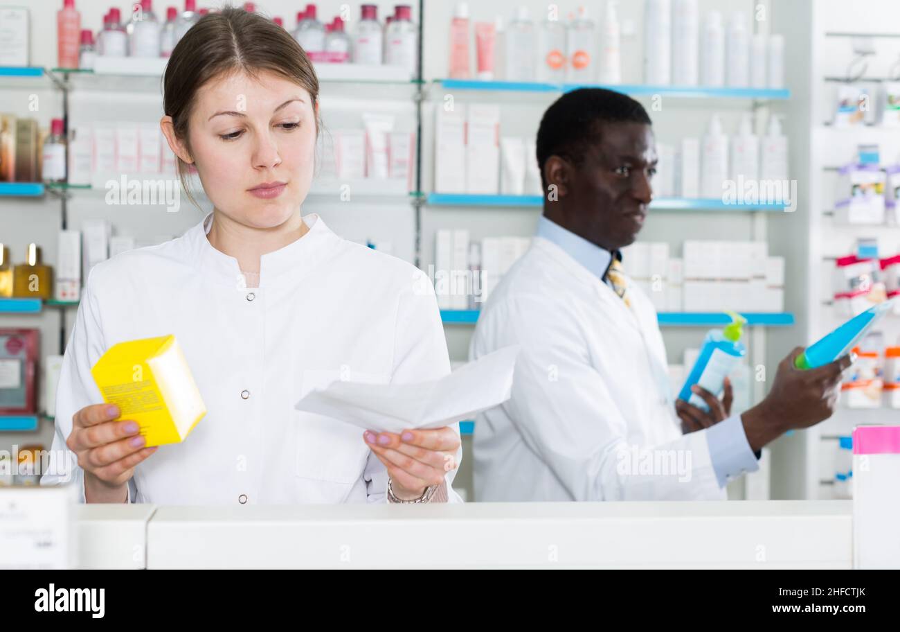 female pharmacist dispensing prescription medicines Stock Photo Alamy