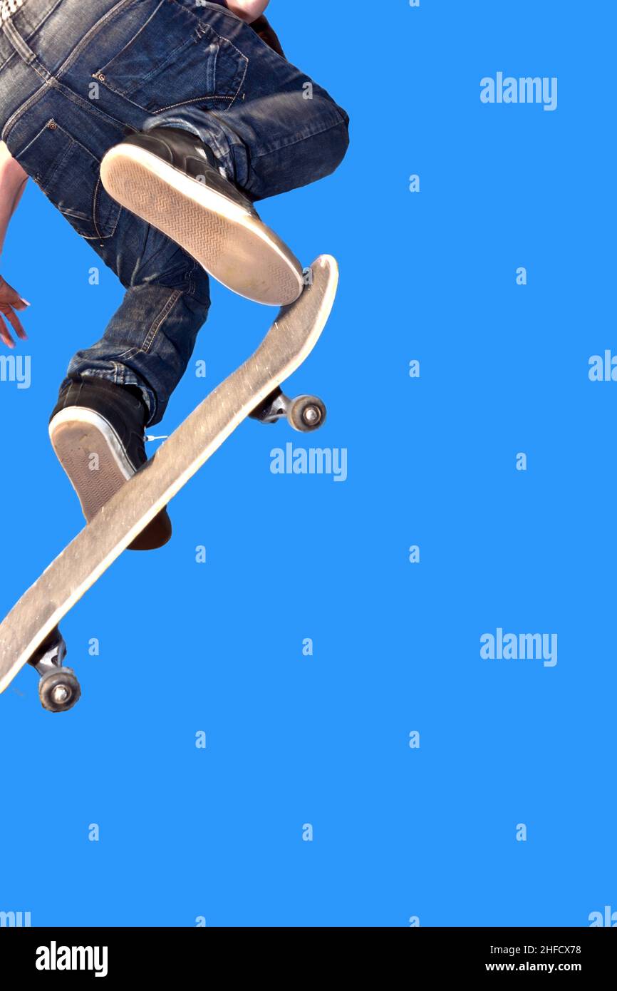 boy with skate board going airborne Stock Photo
