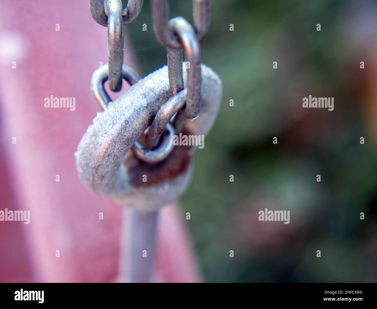frost melts on the chain, in autumn Stock Photo