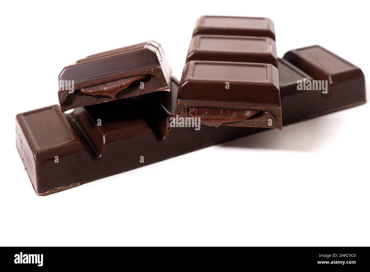 Pieces of chocolate bar with chocolate cream Stock Photo