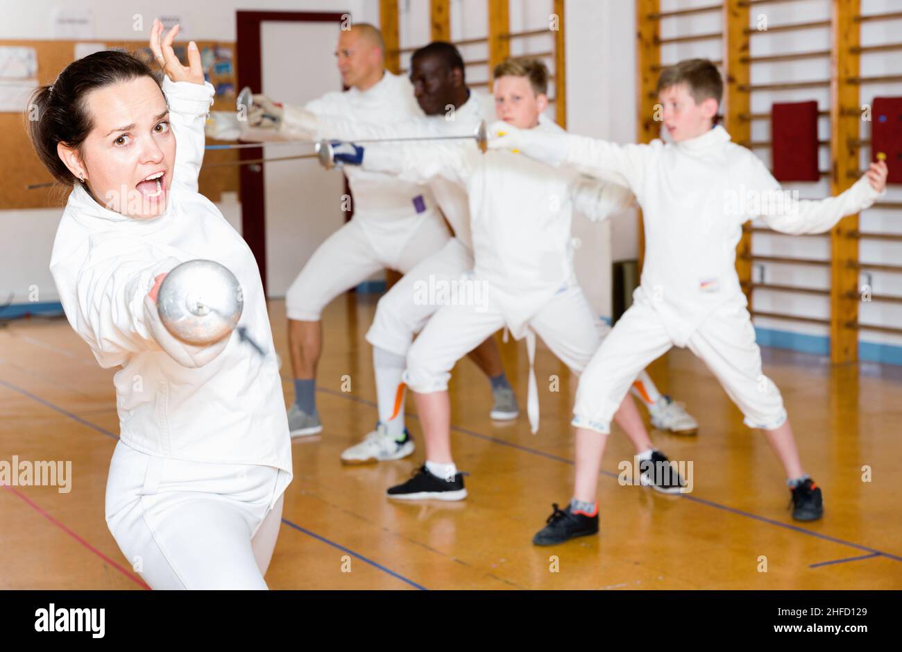 Young woman fencer practicing effective fencing techniques in training room Stock Photo Alamy