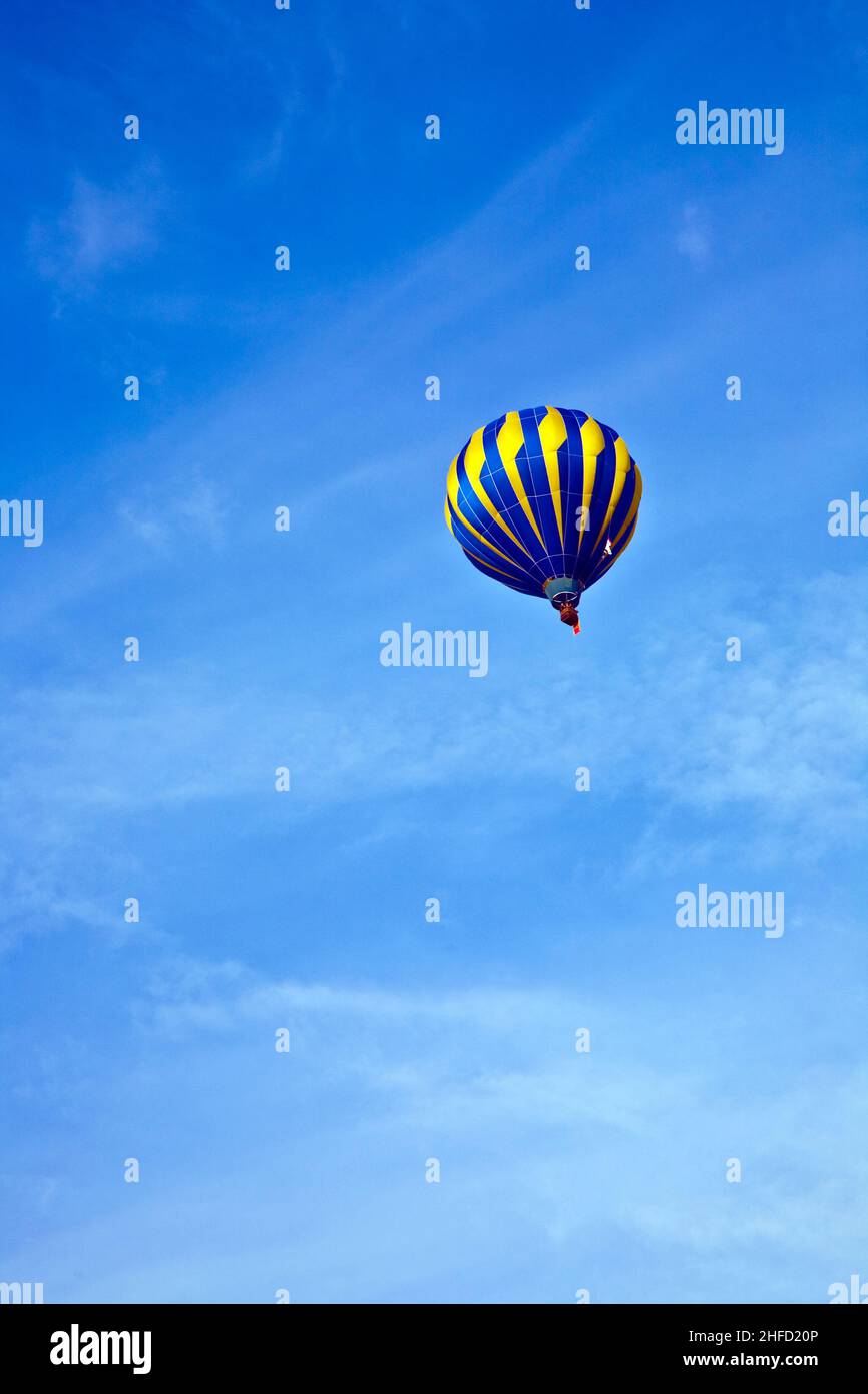 Hot Air Balloon in cloudy sky Stock Photo - Alamy