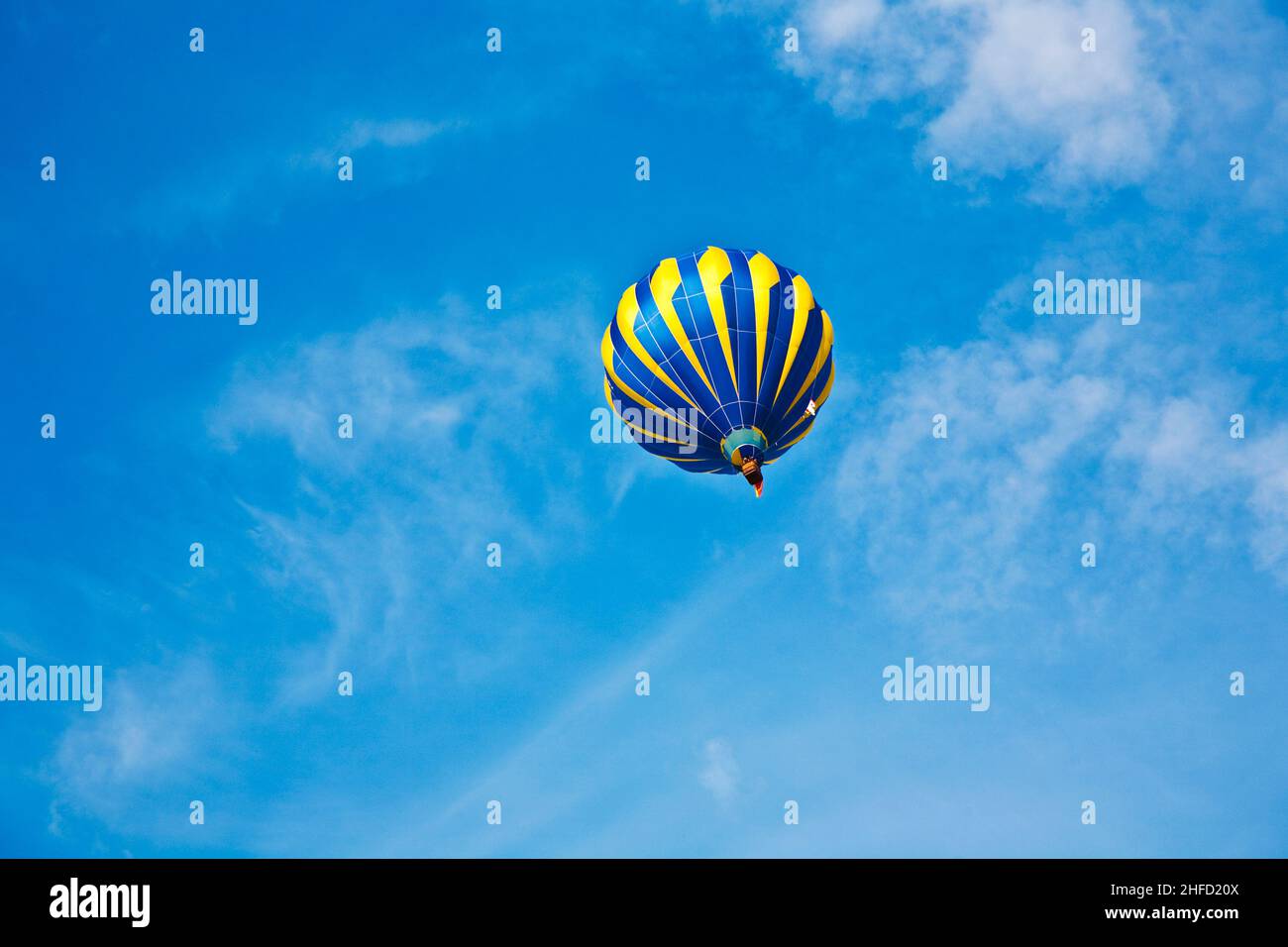 Hot Air Balloon in cloudy sky Stock Photo - Alamy