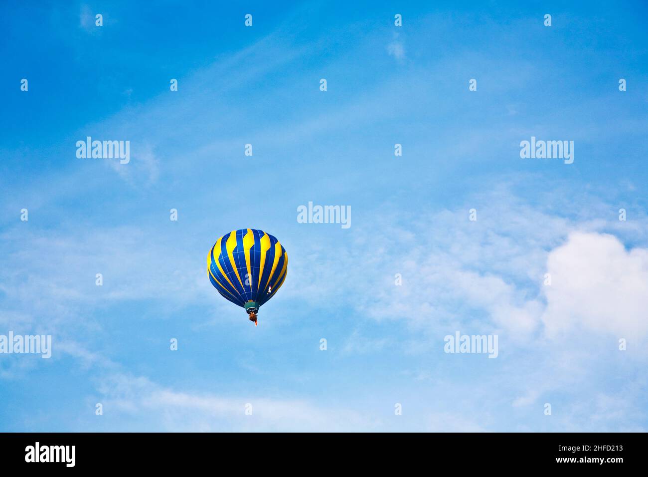 Hot Air Balloon in cloudy sky Stock Photo - Alamy