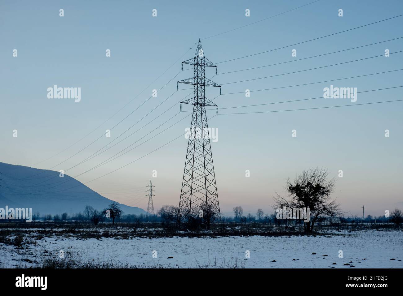 electric power grid cables distribution outdoors in sunset Stock Photo