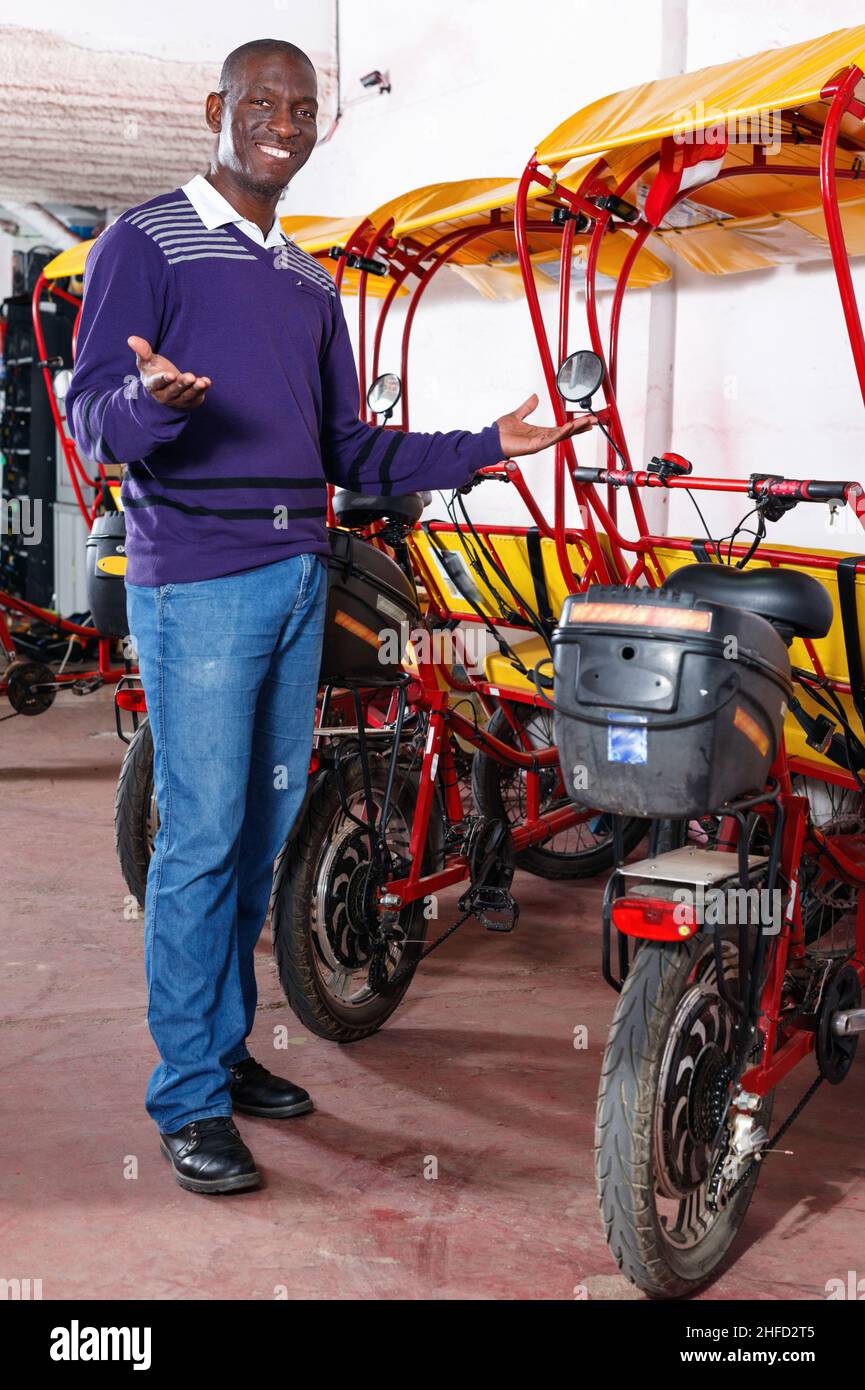 Confident cheerful African-American man recommending traveling with ...