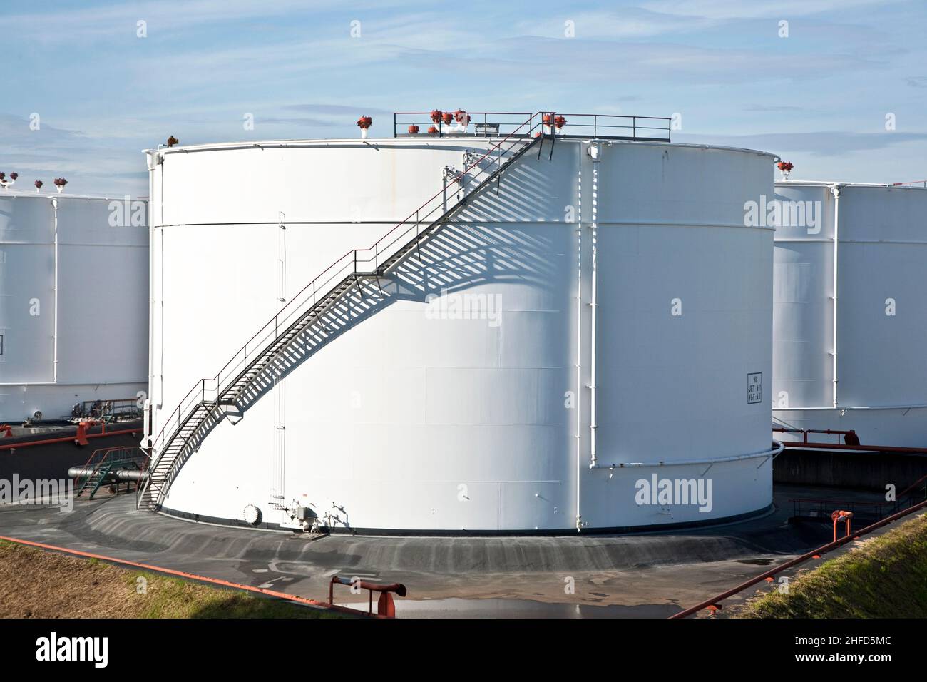 white tanks in tank farm with blue clear sky Stock Photo - Alamy