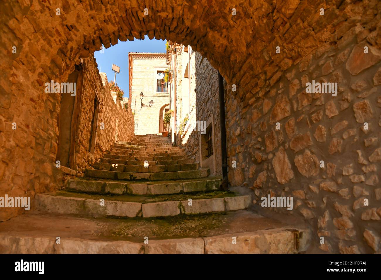 A street among the characteristic houses of Buonalbergo, a mountain village in the province of Benevento, Italy. Stock Photo