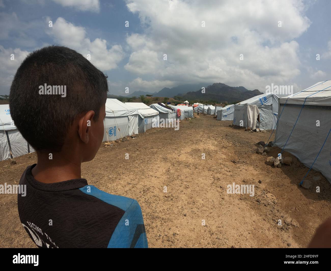Taiz, Yemen- 08 Oct  2021 : A sad child in a camp for displaced people from the war in Yemen, Taiz Stock Photo