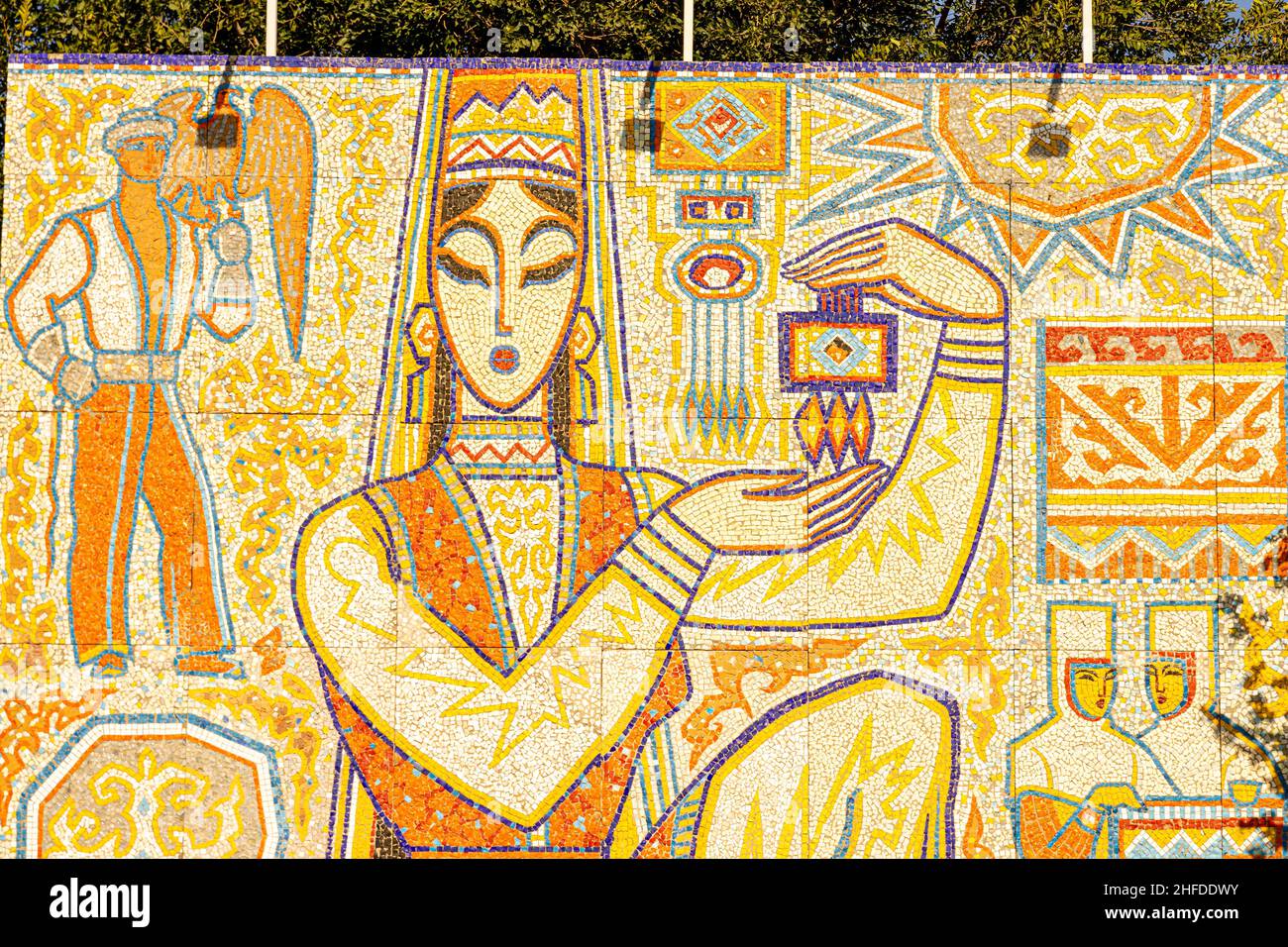 'The Girl with the Souvenir'; 'Sulushash' Tiled mosaic panno installed in Kok Tobe tourist park, depicting Kazakh woman, Almaty. 1970, reinstalled Stock Photo