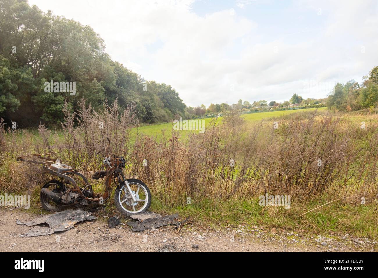 Stolen, burned out and abandoned motorcycle in the countryside Stock ...