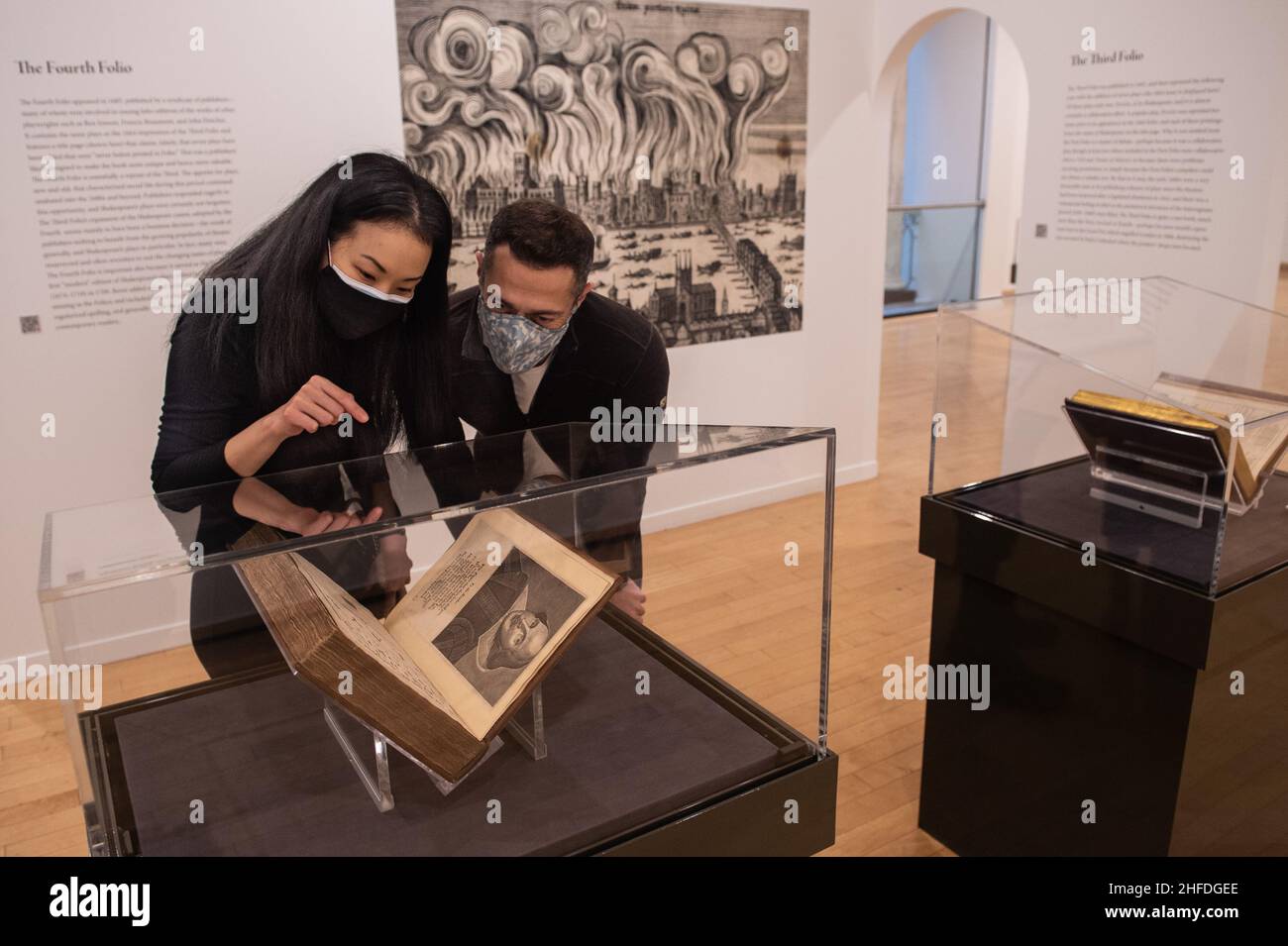 Vancouver, British Columbia, Canada. 15th Jan, 2022. SINAE PARK of Vancouver and ALEXANDER MOULDOVAN, visiting from Florida, admire William Shakespeare's Fourth Folio at the Vancouver Art Gallery Jan. 15. The gallery is displaying all four folios until March 20, including an extremely rare complete first edition of the first, containing 36 of the writer's 38 known plays. The volume was recently acquired by the University of British Columbia through Christie's New York with funding by a consortium of donors from across North America, including the federal Department of Canadian Heritage Stock Photo