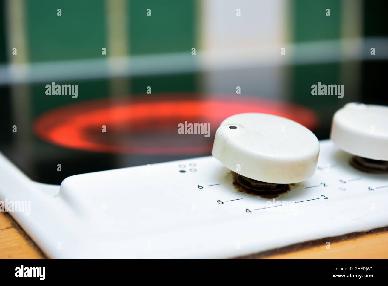 Electric hob in modern home kitchen interior with heat turned up high
