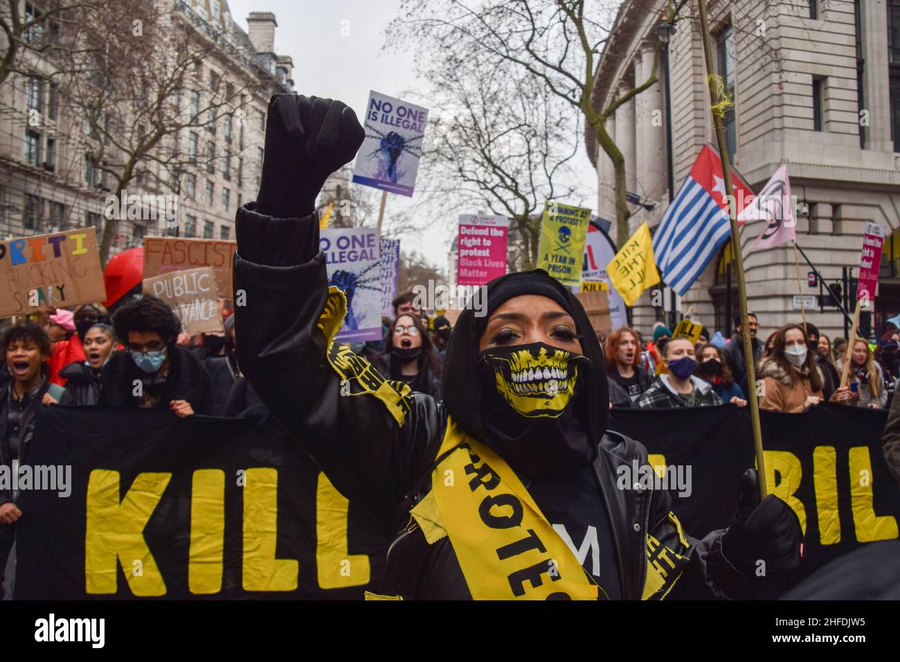 London, UK. 15th Jan, 2022. A demonstrator holds up a fist during the Kill The Bill protest.Thousands of people marched through central London in protest against the Police, Crime, Sentencing and Courts Bill, which will make many types of protest illegal. Credit: SOPA Images Limited/Alamy Live News Stock Photo