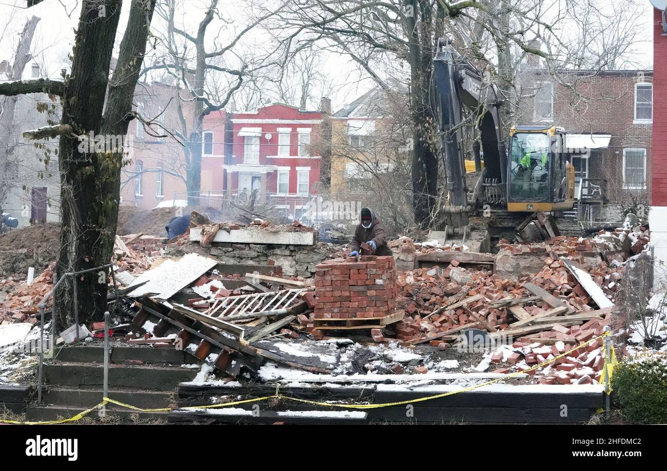 St. Louis, United States. 15th Jan, 2022. Workers stack bricks of what once was a vacant building in St. Louis on Saturday, January 15, 2022. On January 13, 2022, the building collapsed during a fire, killing one St. Louis firefighter and injuring several others. St. Louis reportedly has nearly 10 thousand vacant buildings becoming a hazard for firefighters, being a place to sleep for the many homeless of the area. Photo by Bill Greenblatt/UPI Credit: UPI/Alamy Live News Stock Photo