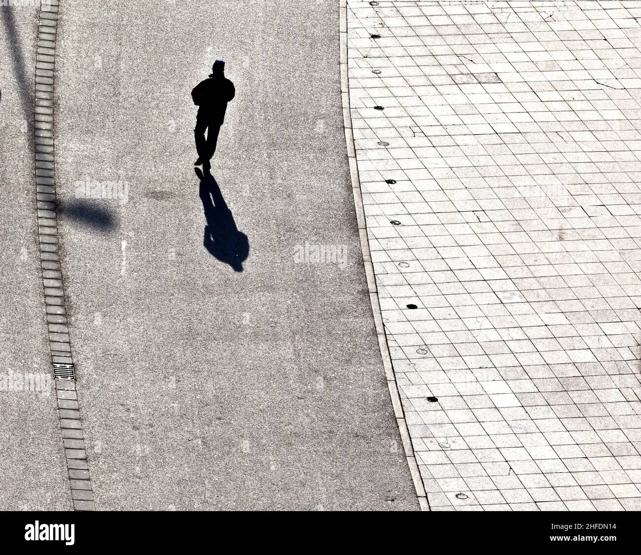 people walking at the street with long shadows Stock Photo - Alamy