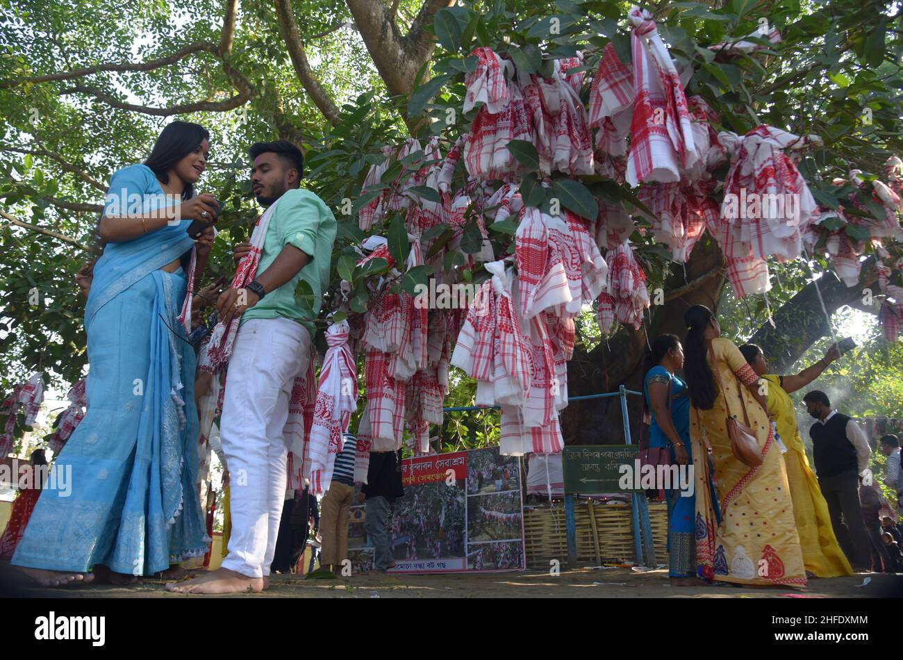 Guwahati, Guwahati, India. 15th Jan, 2022. Devotees tie Assamese
