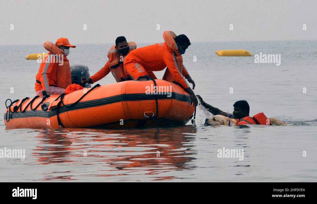 Kolkata, India. 15th Jan, 2022. NDRF personnel with their trained dog at Sagar island during Gangasagar Mela 2022 in West Bengal (Photo by Dipa Chakraborty/Pacific Press) Credit: Pacific Press Media Production Corp./Alamy Live News Stock Photo