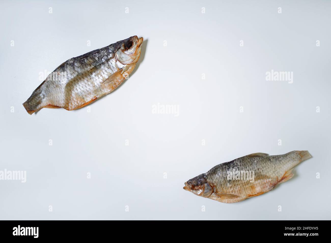 Dried fish on a white background, top view, copy space. Stock Photo