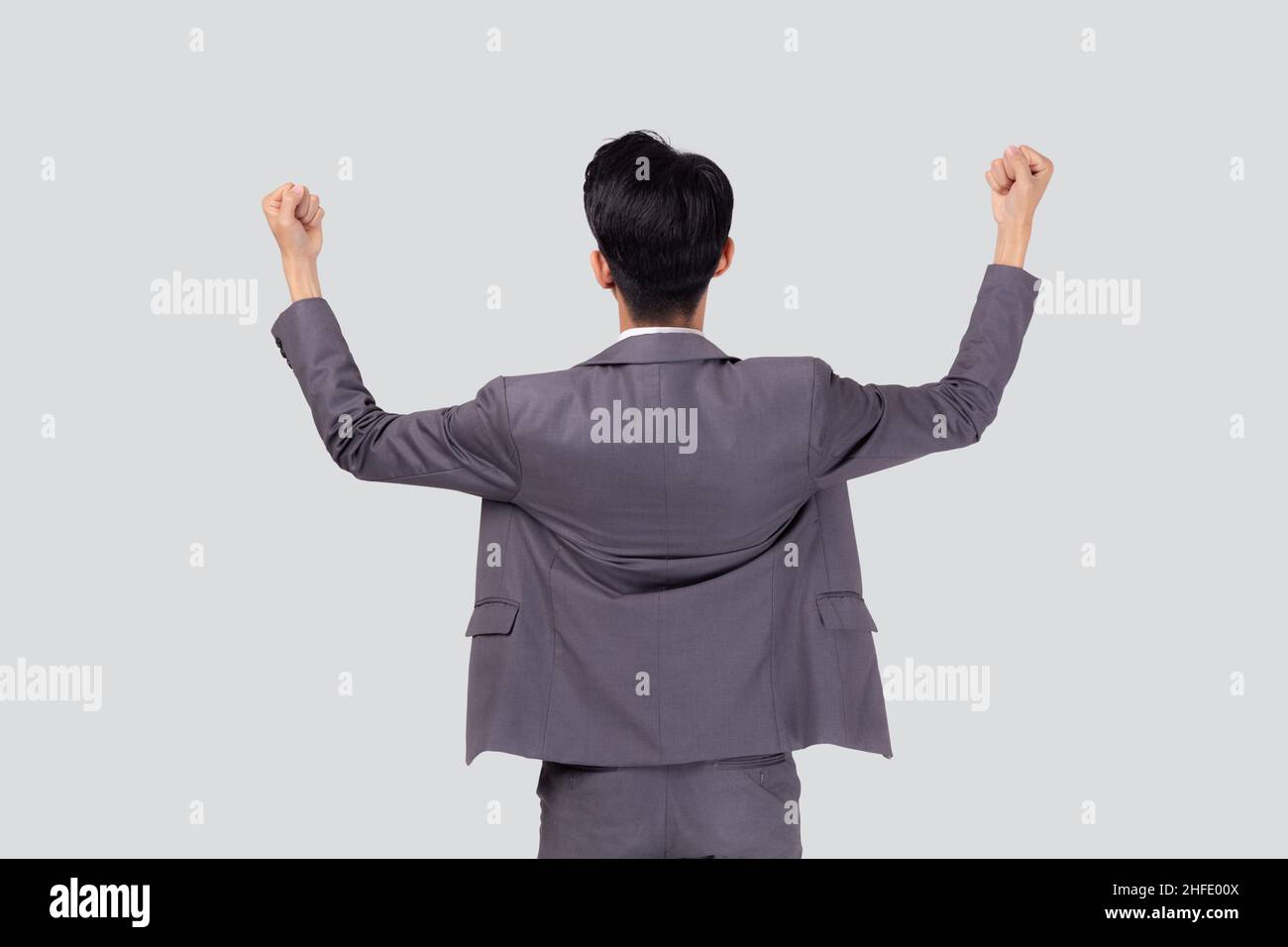 Portrait businessman in suit standing with win success isolated on ...