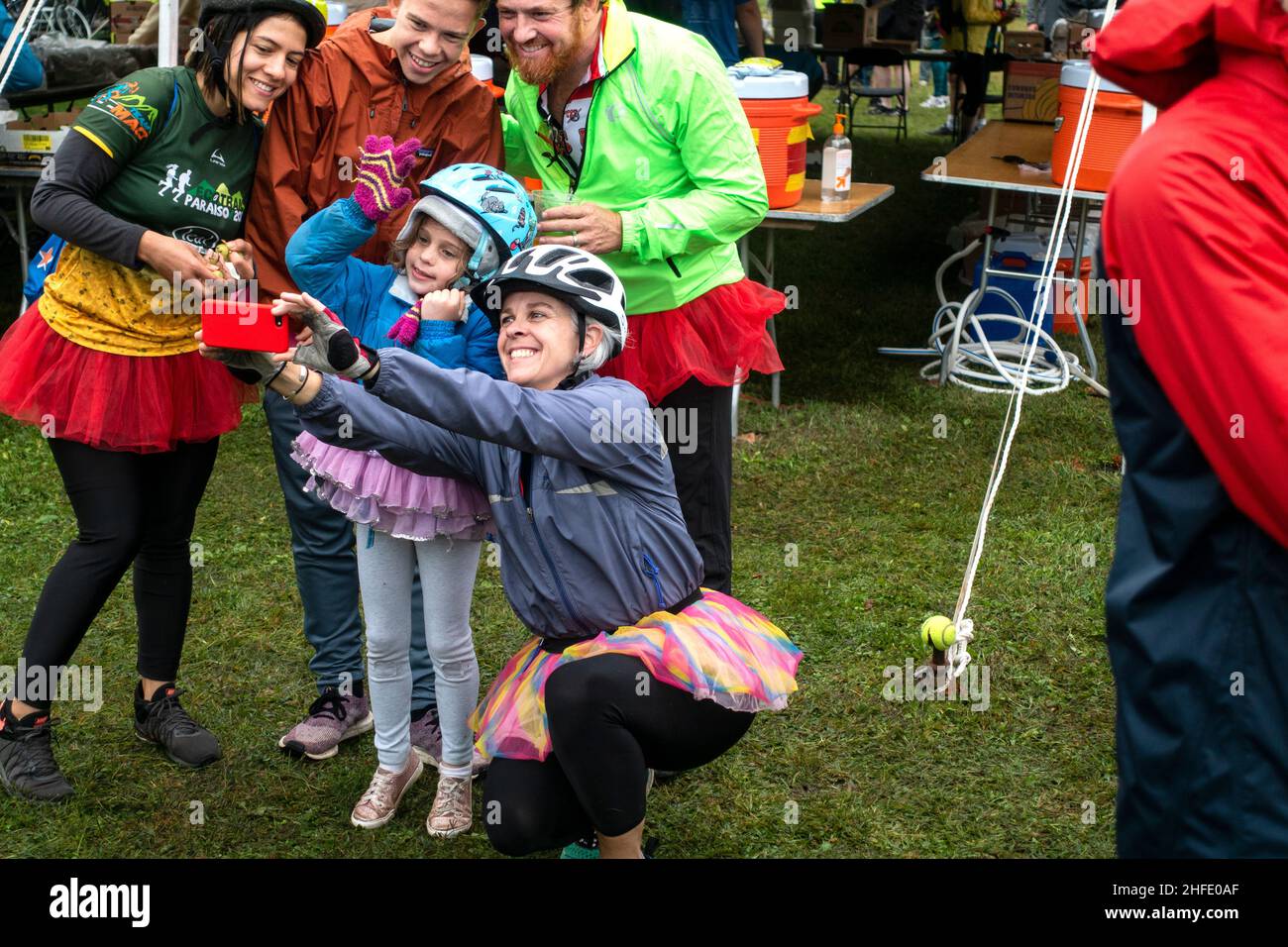 Family dressed in tutu skirts taking selfie before riding in the St. Paul Classic Bike Tour 2019. St Paul Minnesota MN USA Stock Photo