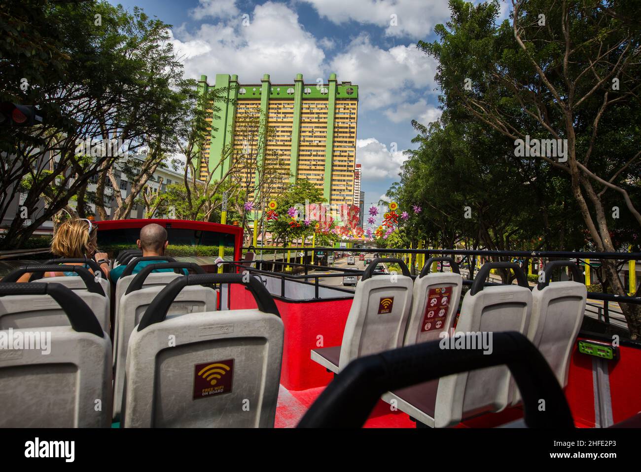 Open top bus turning to Chinatown to check out the heritage and festive mood. Jan 2022, Singapore. Stock Photo