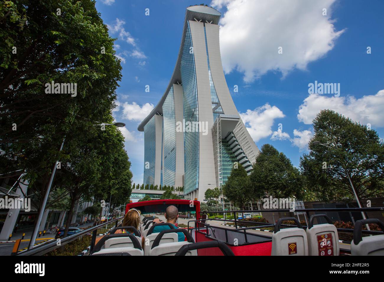 Open top bus heading towards Marina Bay Sands skyscraper. Singapore. Stock Photo