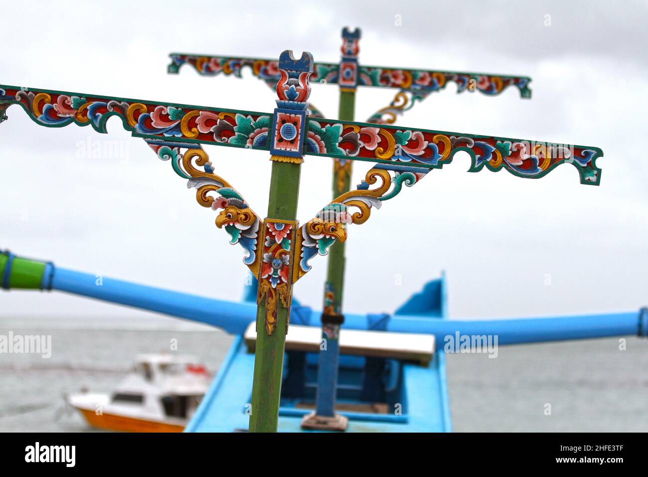 Close-up view showing the carved and painted detail of a perhau boat at Tuban Beach, Bali in Indonesia. Stock Photo