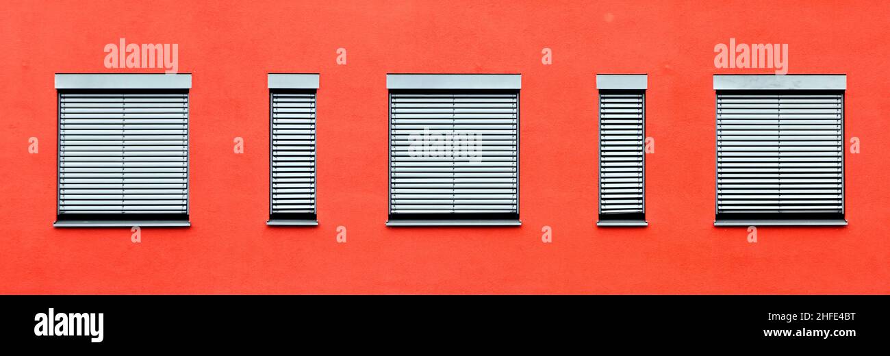 pattern of windows with red wall Stock Photo - Alamy