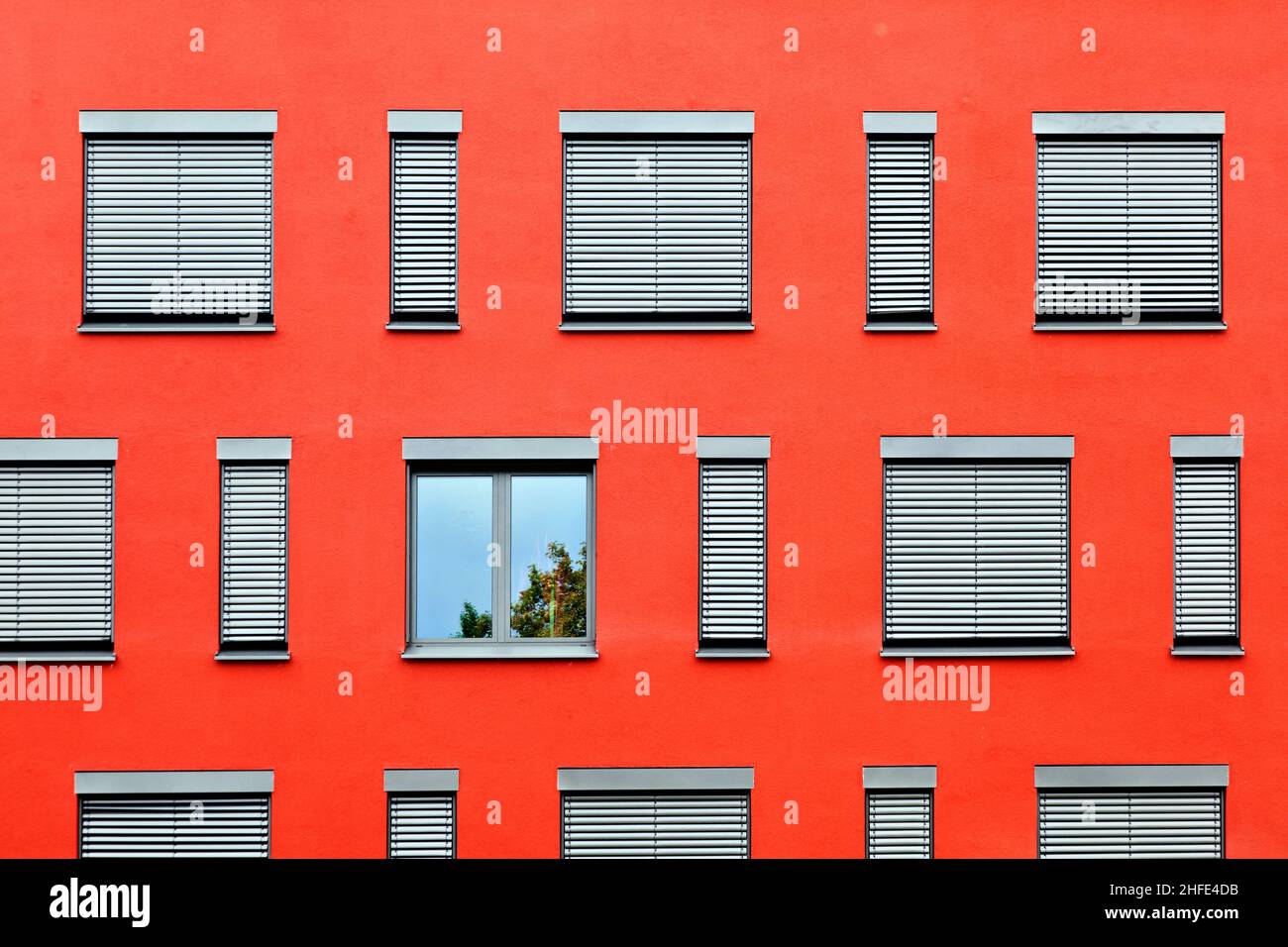 pattern of windows with red wall Stock Photo - Alamy