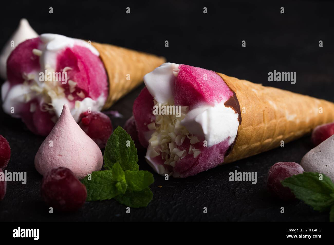 Strawberry ice cream in a waffle cone on a blue background Stock Photo ...