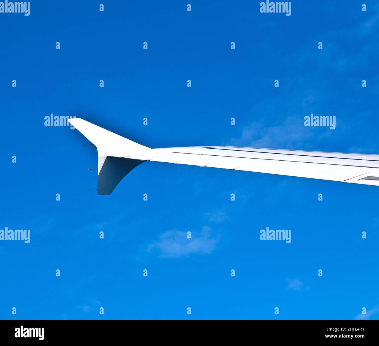 wing of aircraft in the blue sky Stock Photo - Alamy