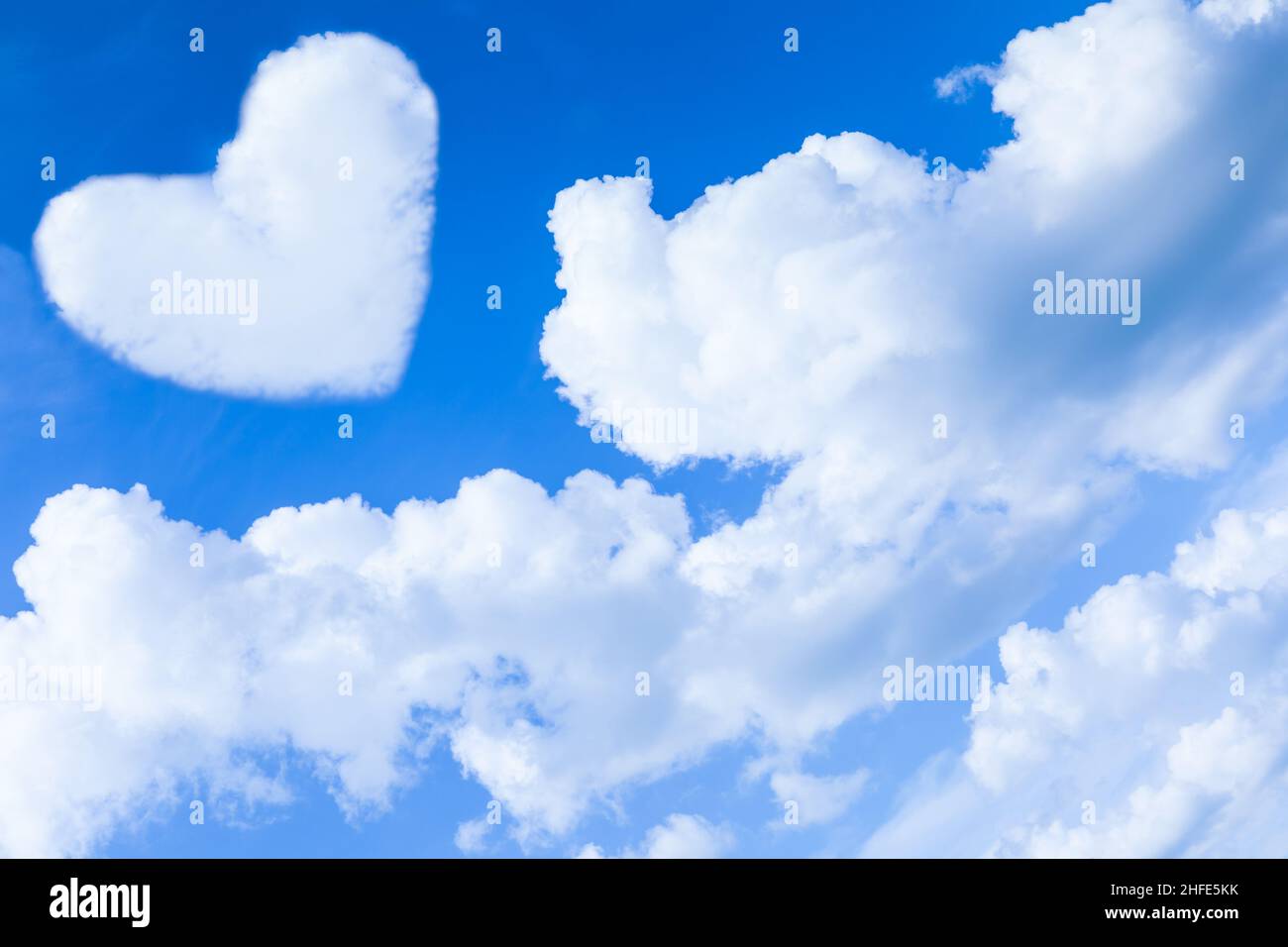 Blue sky with heart-shape clouds, beauty natural background Stock Photo ...