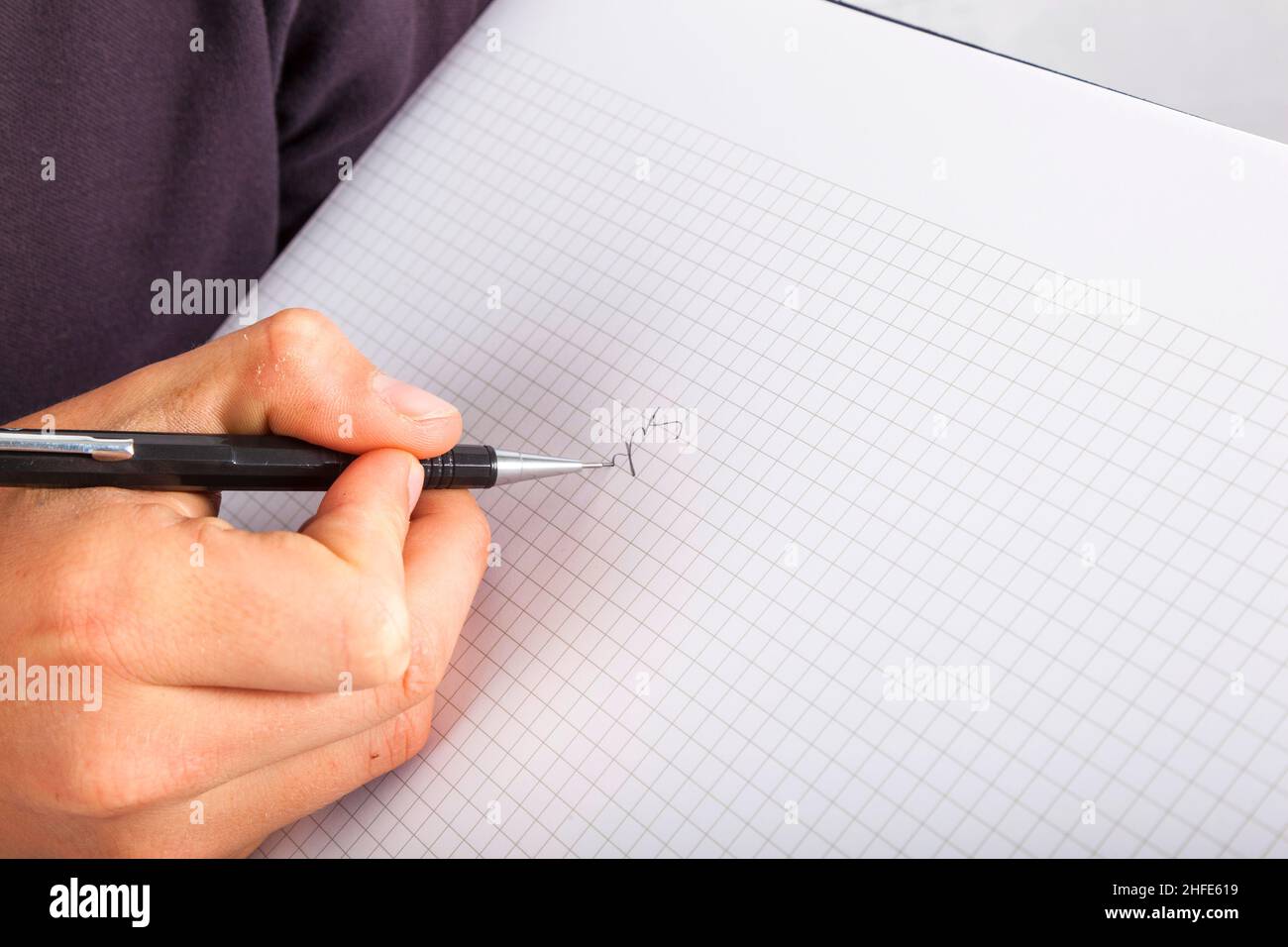 boy writing in a black book Stock Photo - Alamy