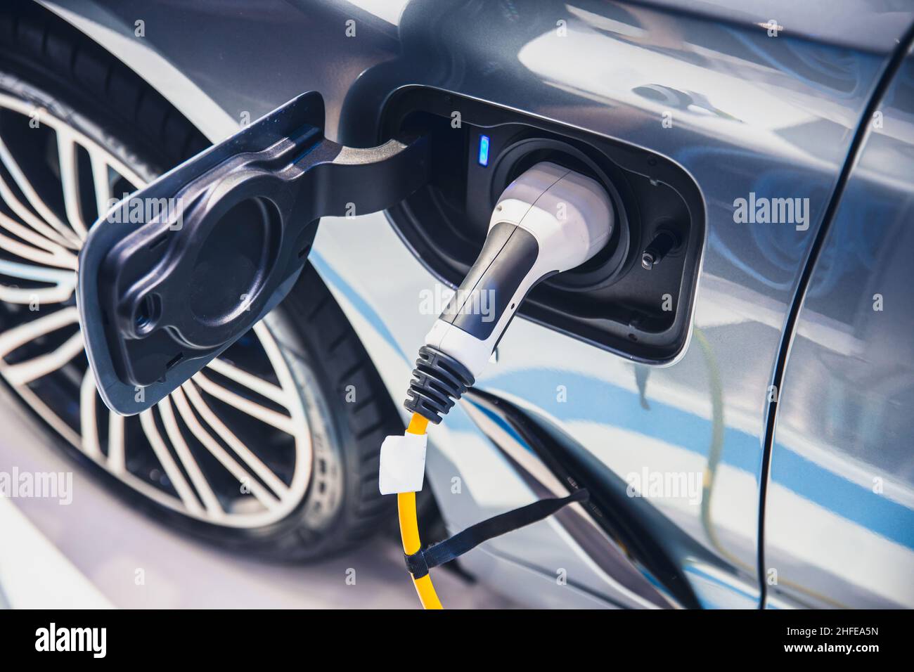charging EV car electric vehicle clean energy for driving future Stock Photo