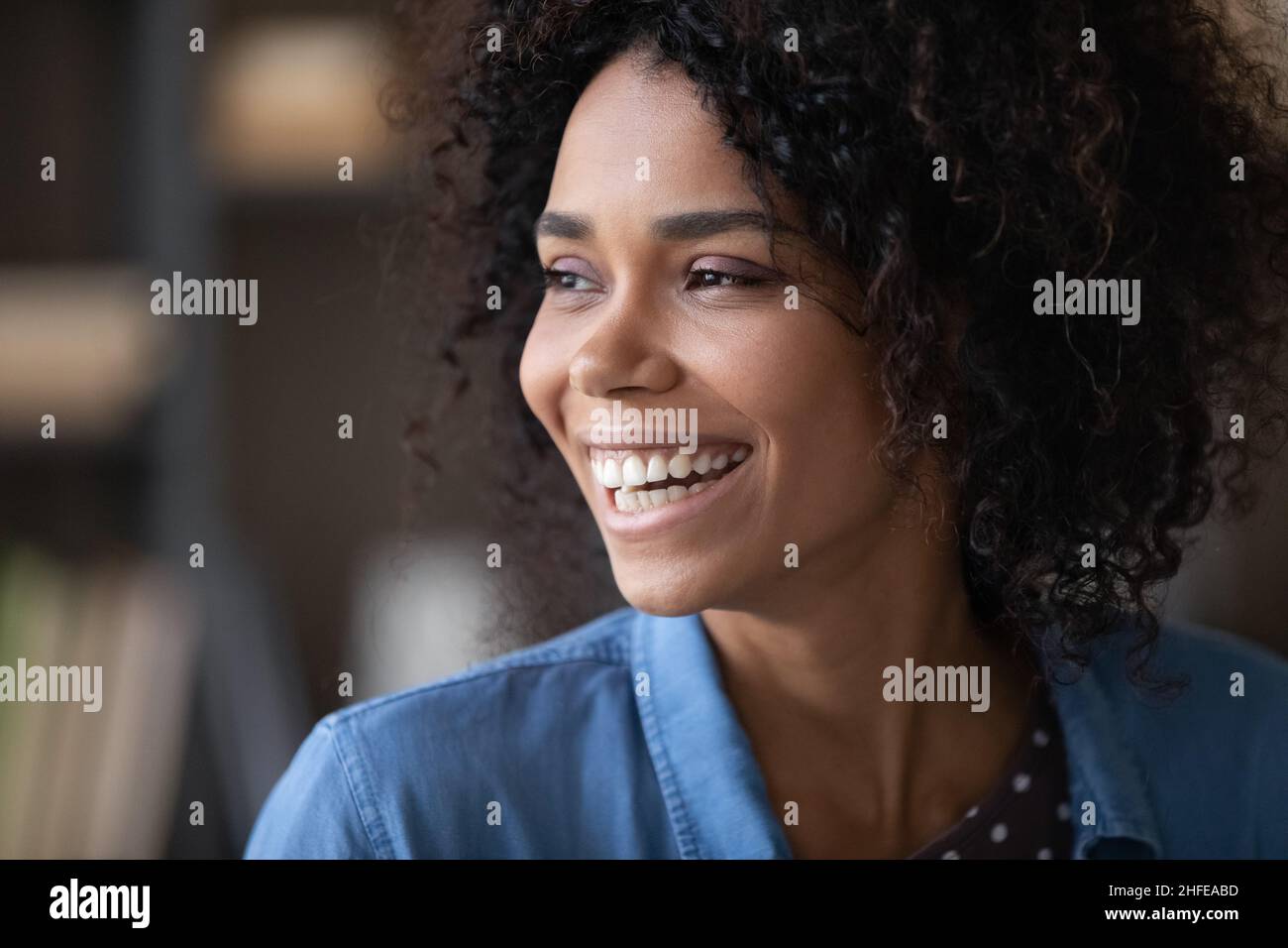 Happy cheerful pretty Black girl looking away with toothy smile Stock ...