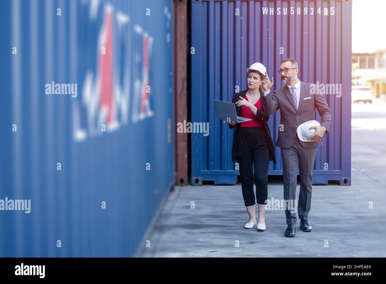 Business man working with women team or secretary in port cargo logistics industry Stock Photo