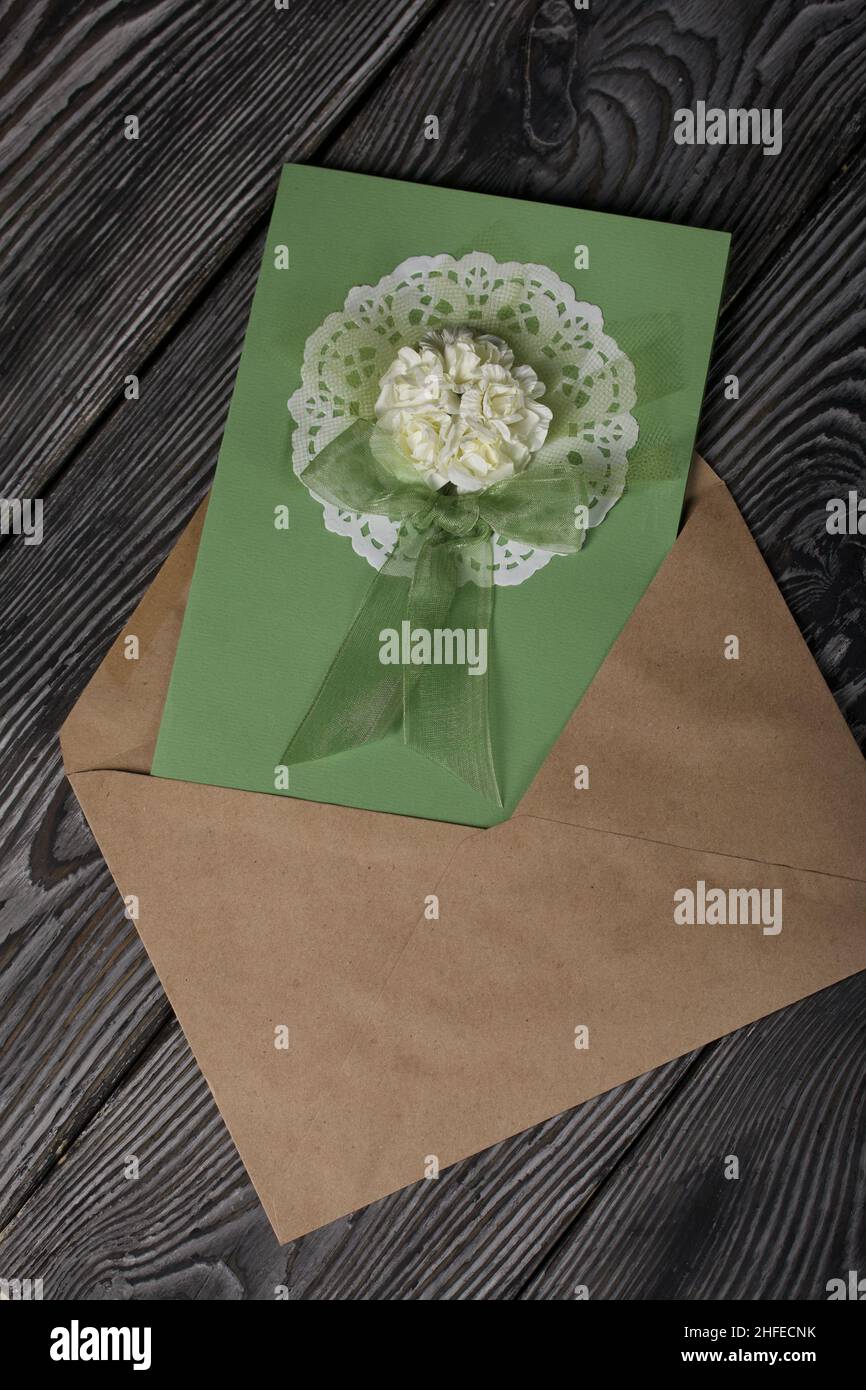 Greeting card in an envelope. On pine boards. Stock Photo