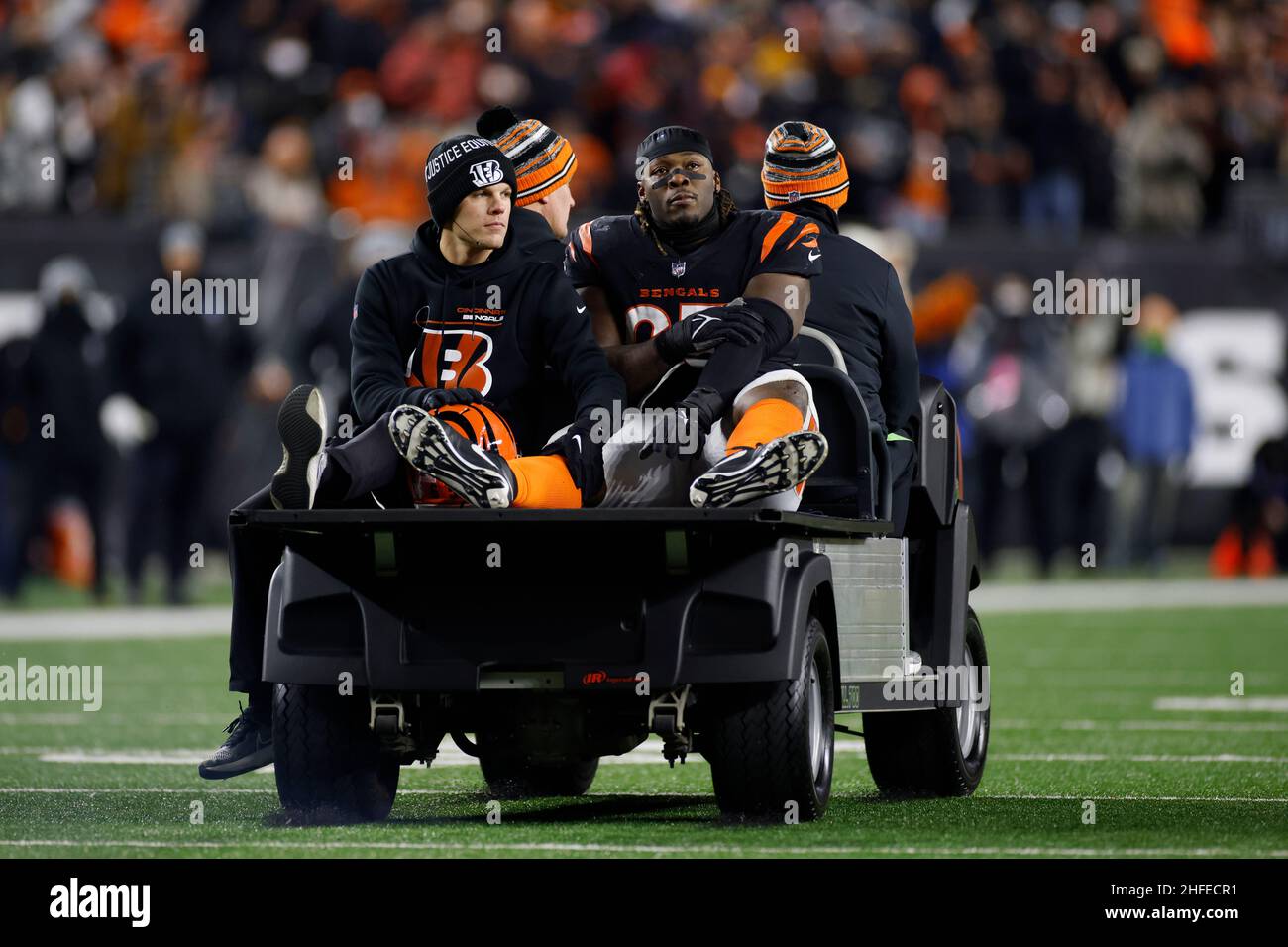 Cincinnati Bengals defensive tackle Larry Ogunjobi (65) is carted off the field following an injury during an NFL Wild-Card Playoff football game agai Stock Photo