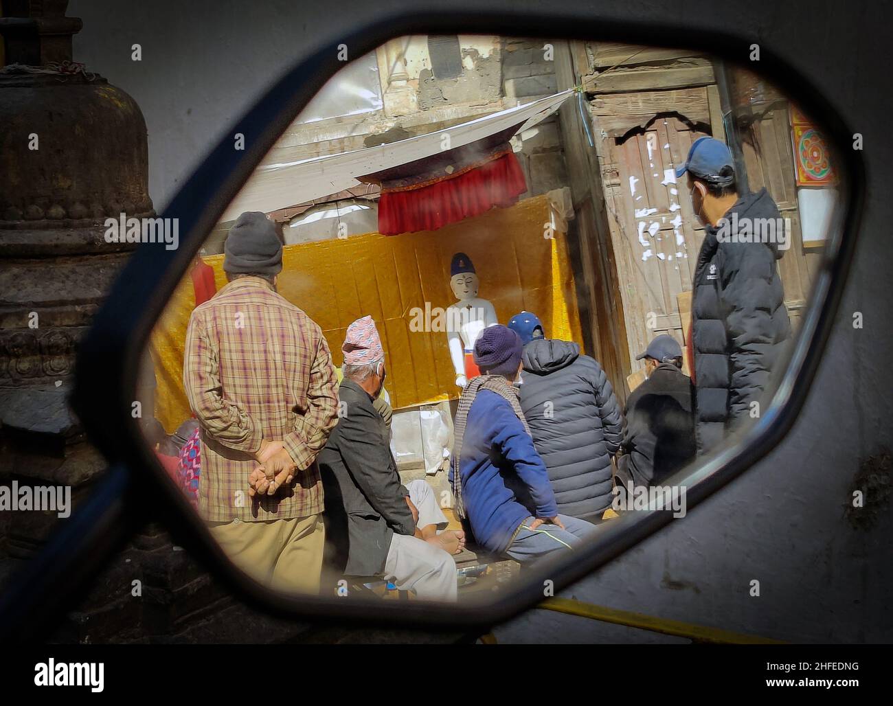 Kathmandu, Bagmati, Nepal. 16th Jan, 2022. People get reflected in a mirror as they observe the