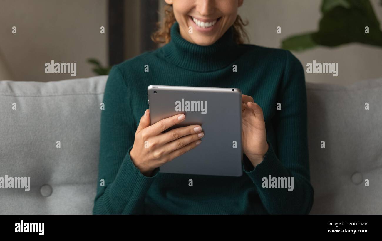 Close up young woman using digital computer tablet. Stock Photo