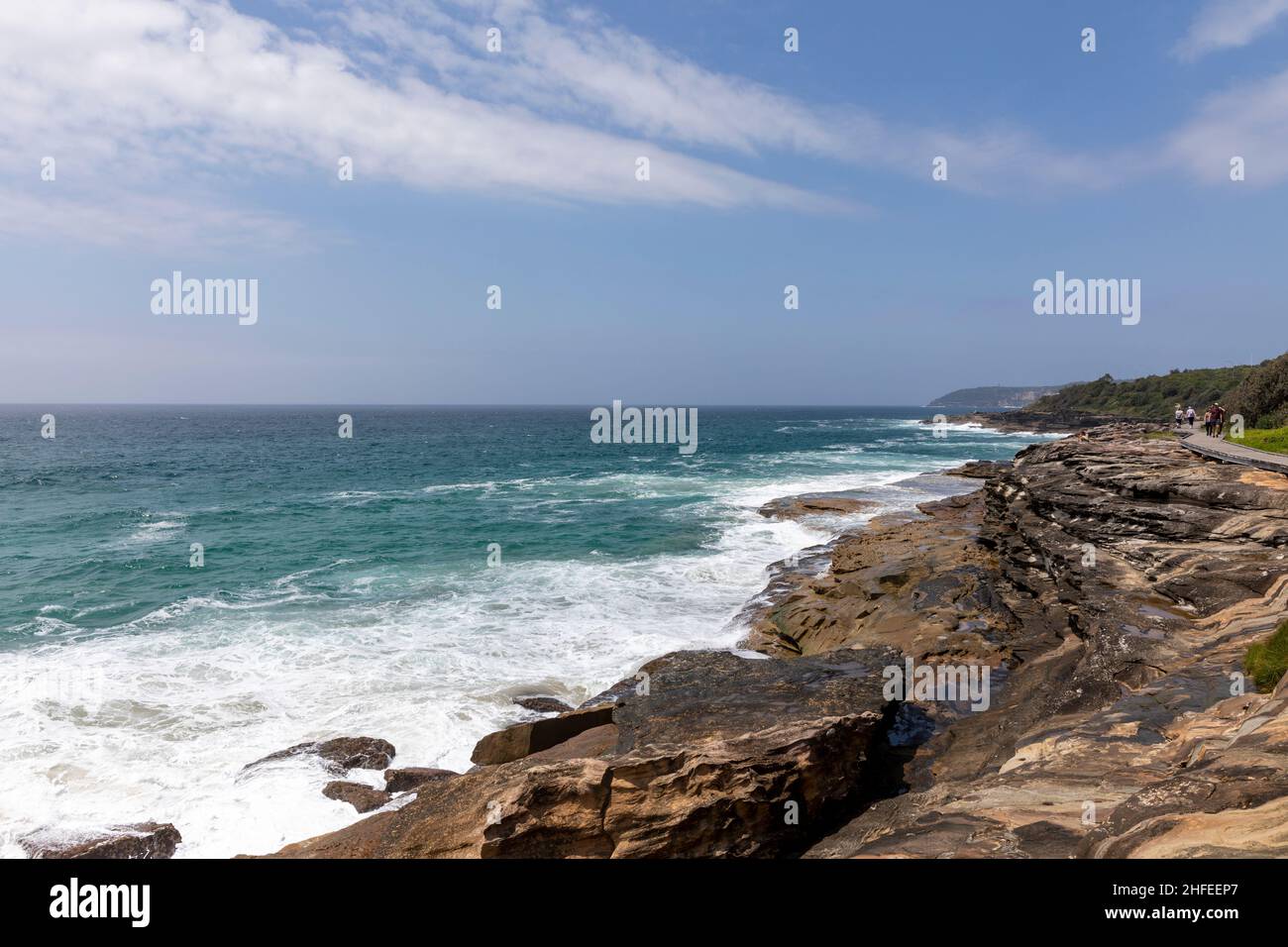 Curl Curl boardwalk renamed Harry Eliffe Way between Curl Curl and Freshwater Sydney gives dramatic coastal views, tsunami warning issued today jan 22 Stock Photo