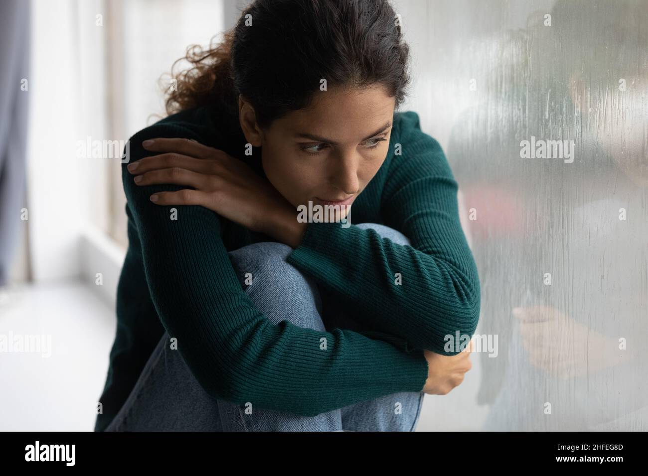 Depressed young woman suffering from psychological problems. Stock Photo