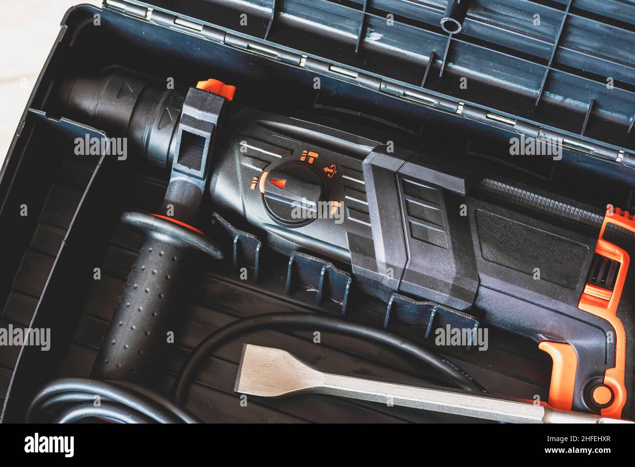 Hammer in a box close up.  rotary hammer, rotary drill, perforator, chisel in a case for tools close up. Stock Photo