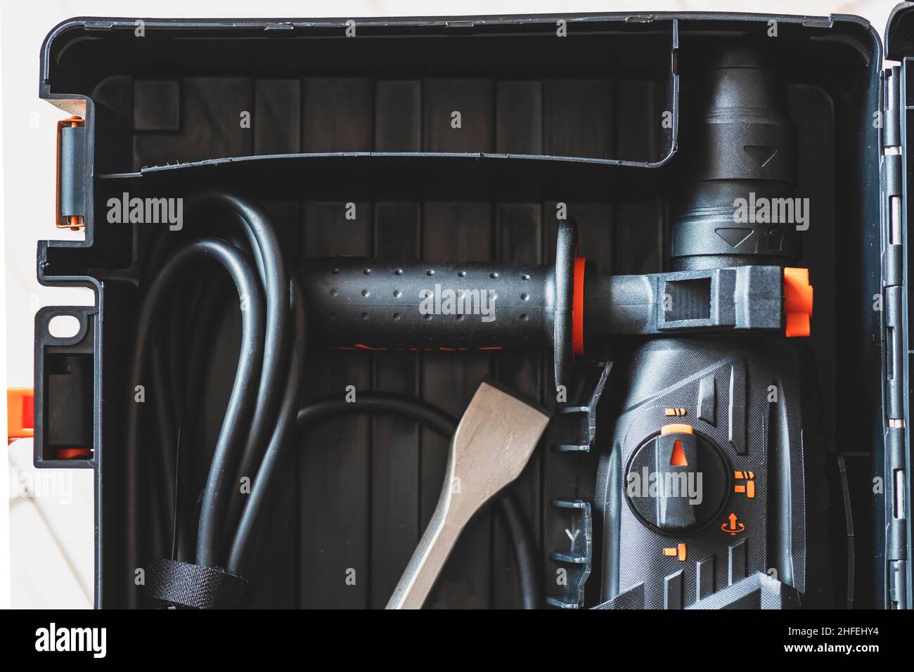 Hammer in a box close up.  rotary hammer, rotary drill, perforator, chisel in a case for tools close up. Stock Photo