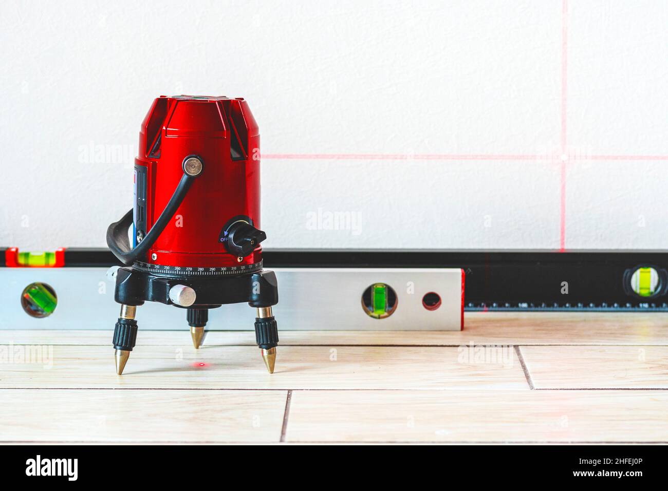 Laser level and Bubble levels, lines on the wall. measuring with red