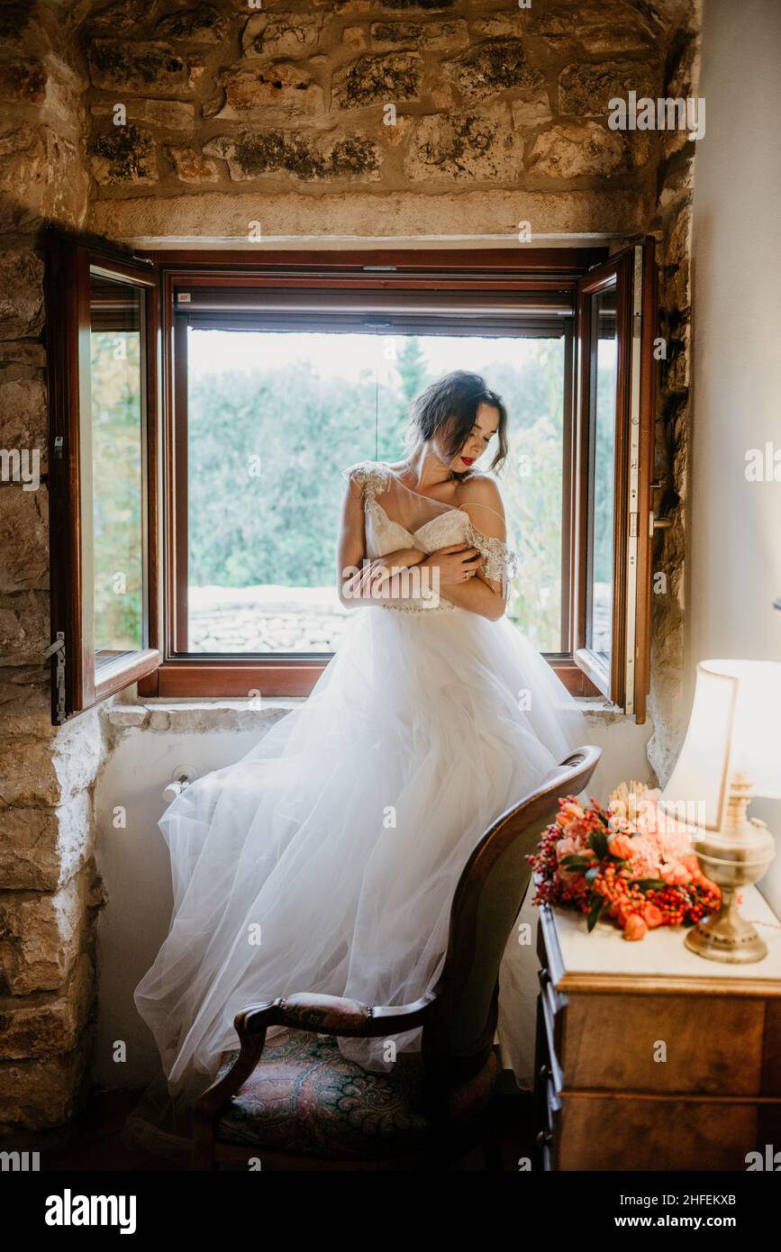 Artistic processing Fantasy girl princess in WHITE WEDDING dress stands in  medieval CASTLE room looking vintage window. Bride in a luxury apartment in  Stock Photo - Alamy, image size:867x1390