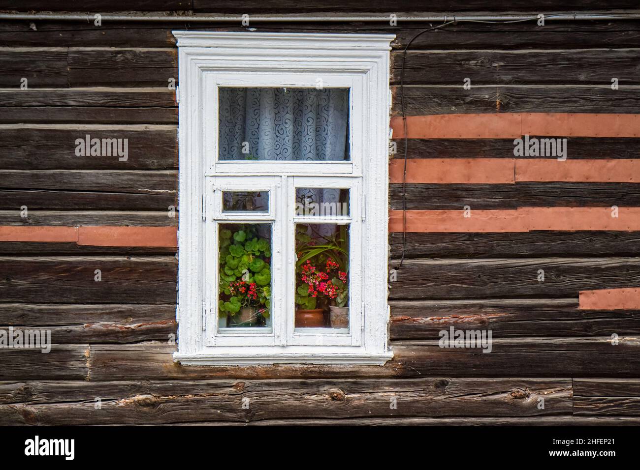 flowers and curtains in the window of an old wooden house Stock Photo ...