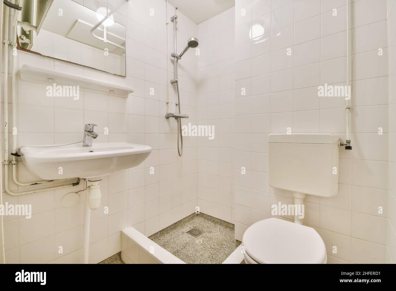 Stunning small bathroom with shower and toilet Stock Photo Alamy